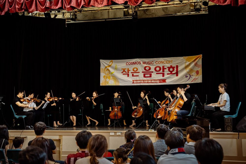 Cosmos Music Concert string ensemble on stage